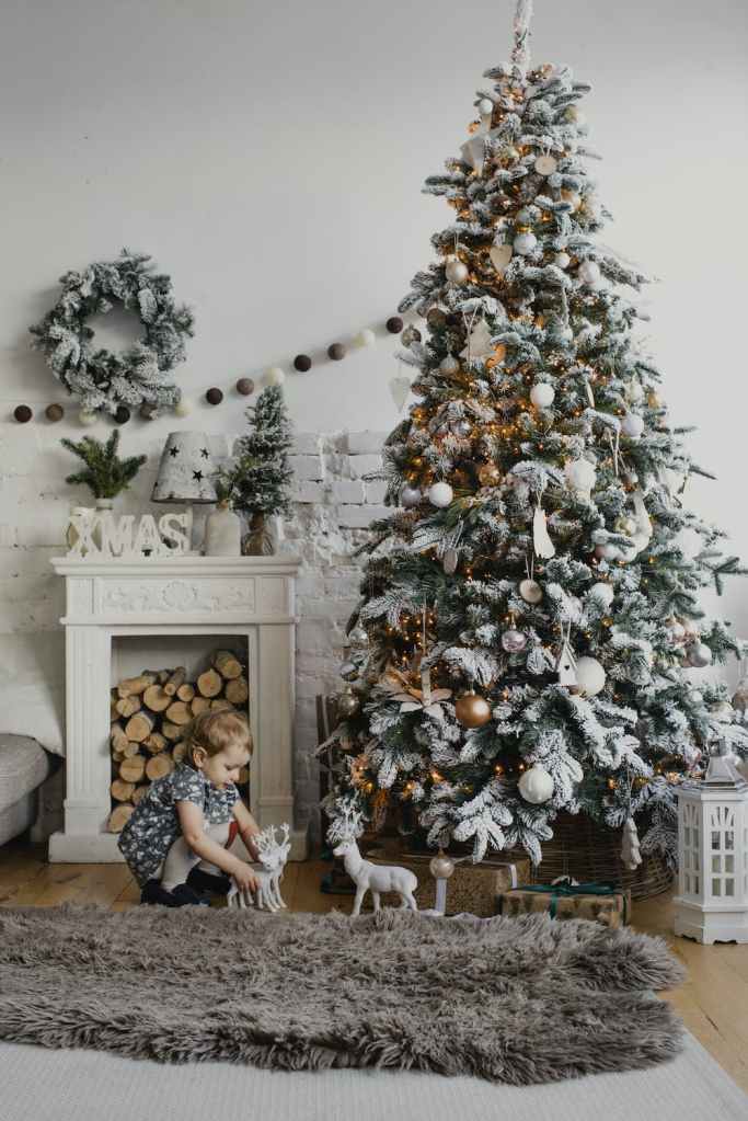 Child with Christmas tree